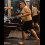 太った男性がランニングマシンで走る